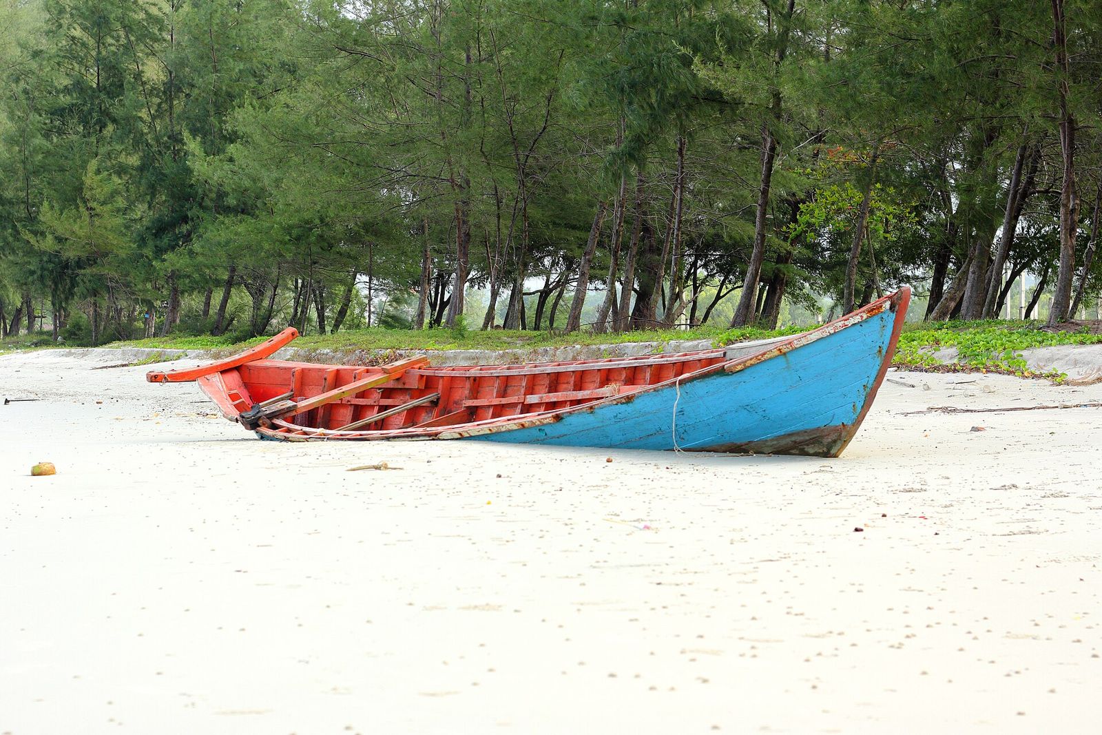 Wooden fishing boat on the sandy coast near Sihanoukville